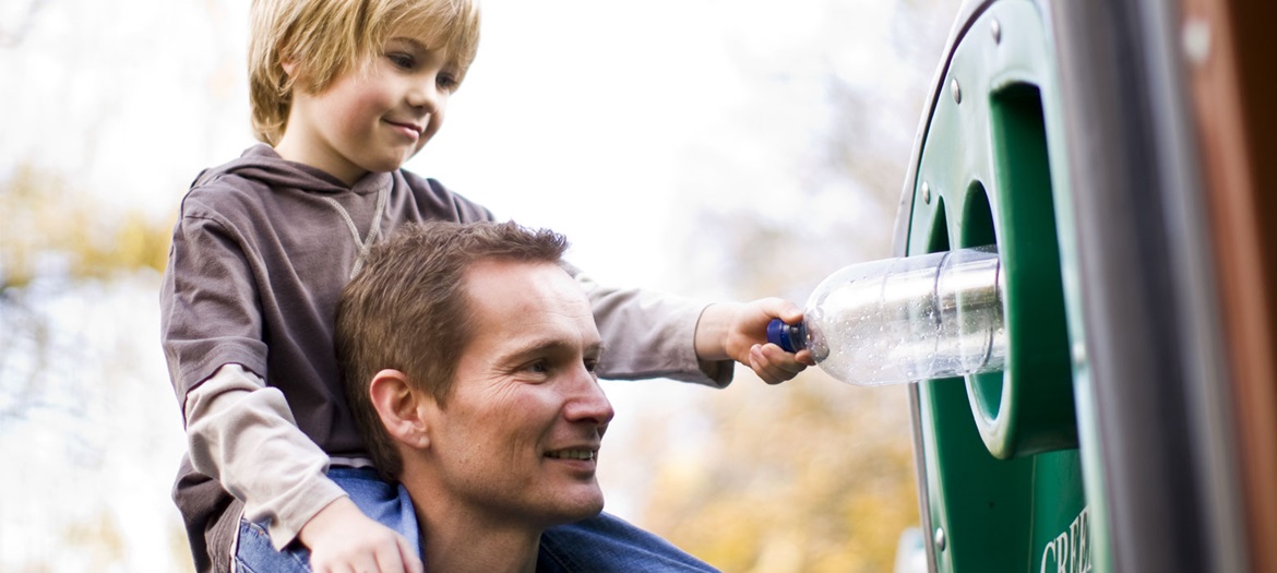 Man and the child doing recycling